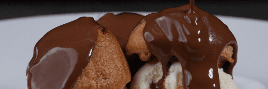 The prevalence of profiteroles with ice cream and chocolate speaks to France's Culinary Influence Across the Globe